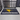 A black floor mat featuring the Humminbird logo displayed in a garage.