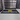 A black mat with the text 'MINN KOTA' and a yellow logo, placed on a garage floor.