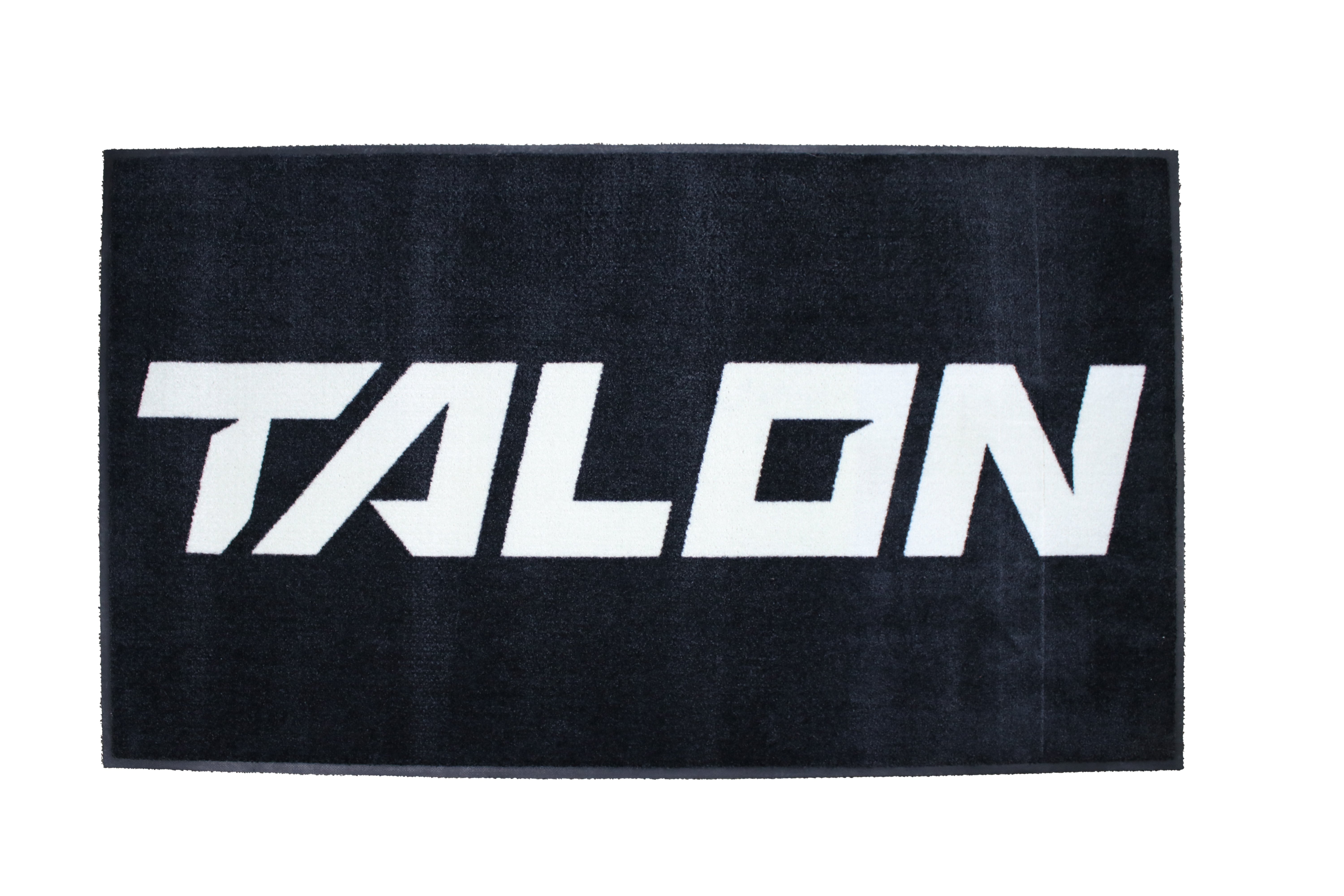 Black mat featuring the word 'TALON' in large white letters.
